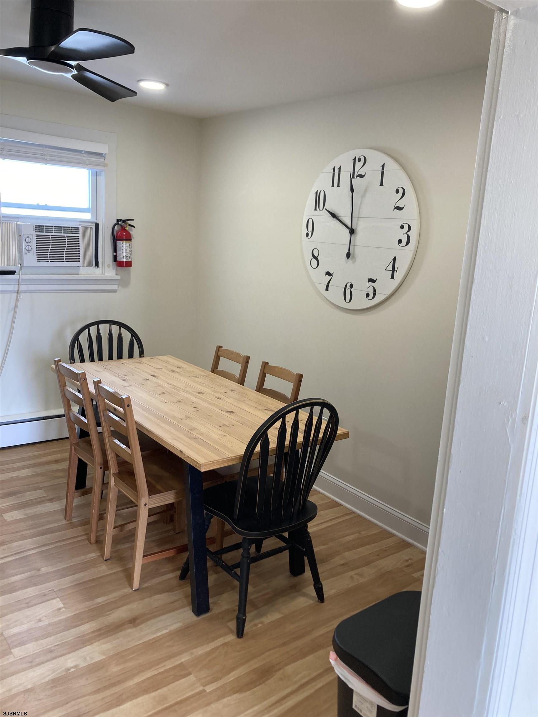 273 38th Street South, Unit A / B Brigantine, NJ 08203 - Photo 6 of 7 a view of a dining room with furniture and wooden floor