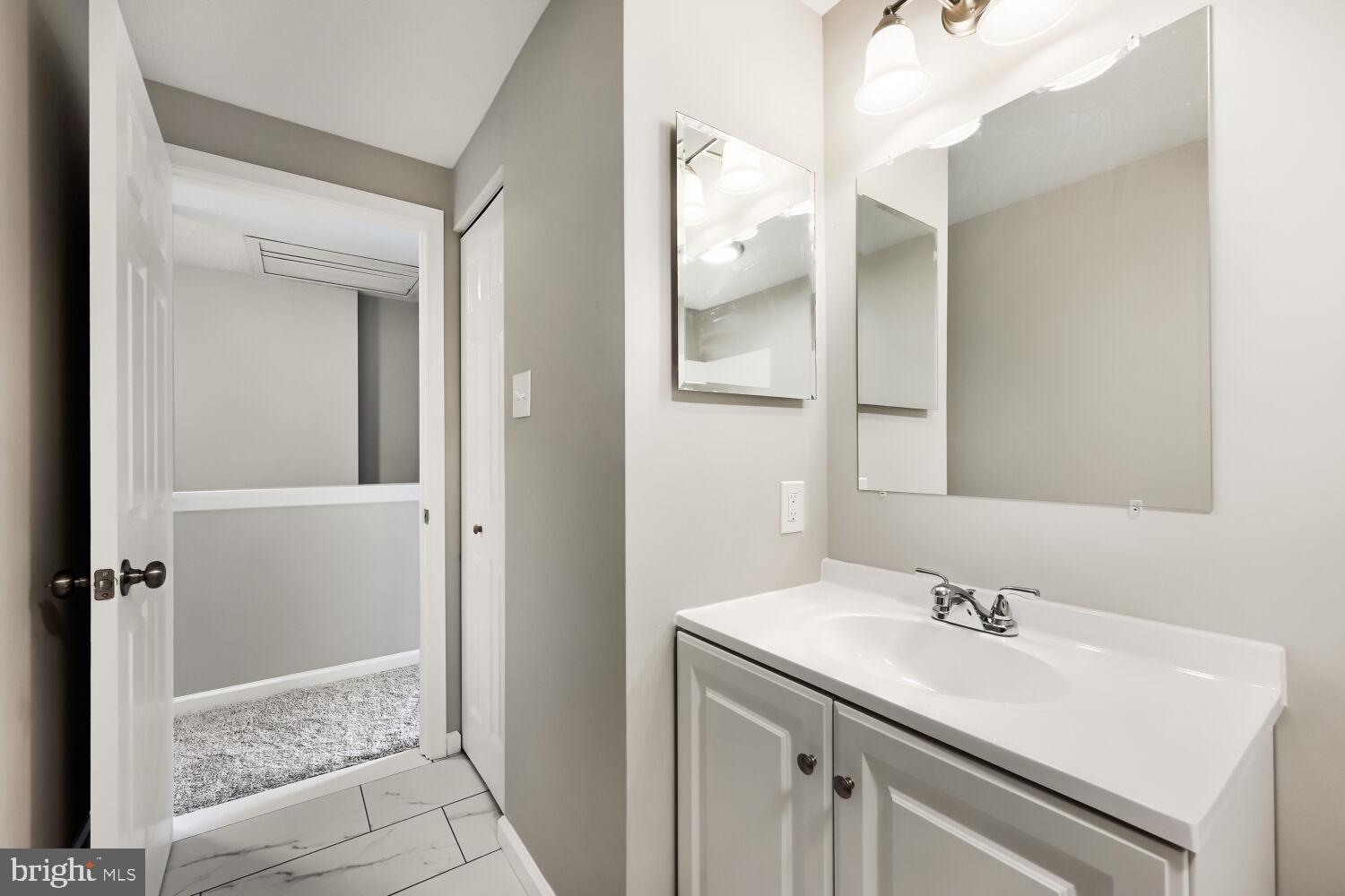 2254 Riding Crop Way Windsor Mill, MD 21244 - Photo 19 of 29 Modern bathroom with sleek finishes.