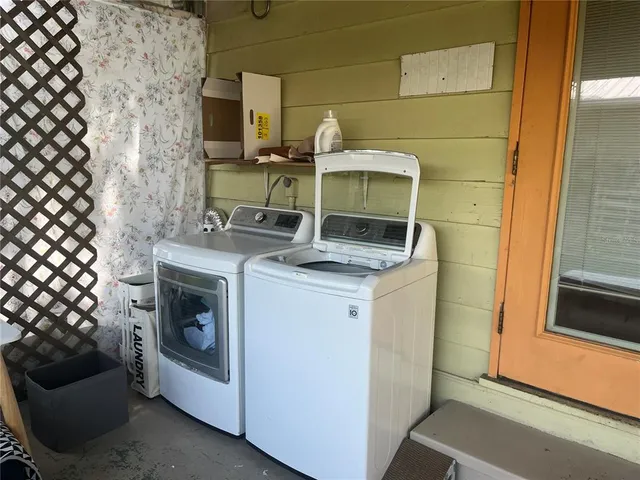 a utility room with dryer and washer