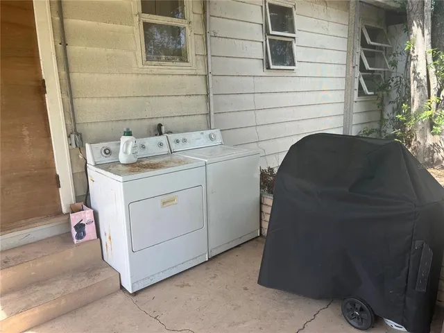 a utility room with a sink a washer and dryer