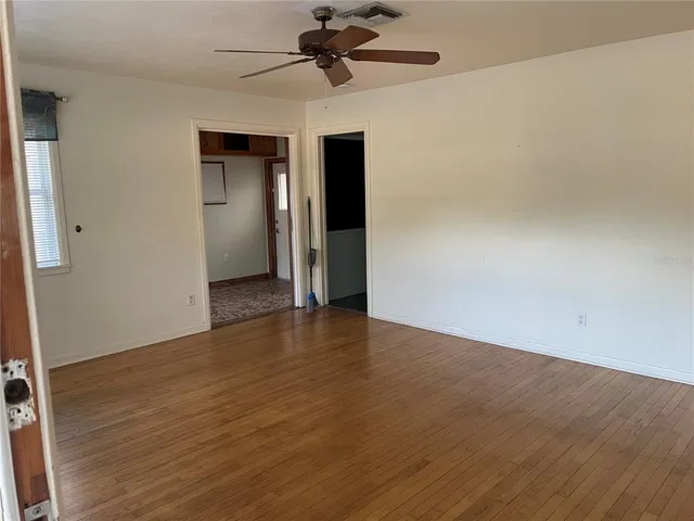 a view of a livingroom with wooden floor
