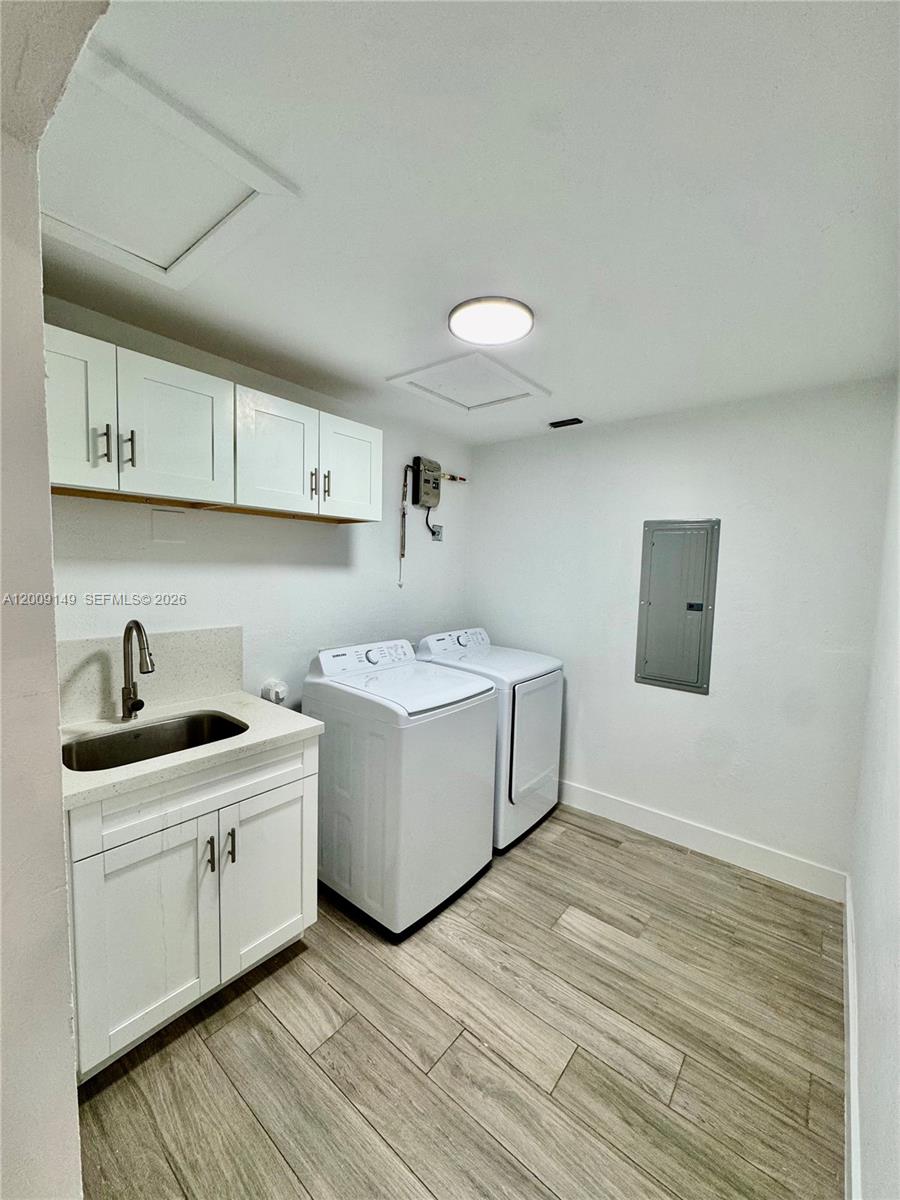 11770 Southwest 178th Terrace Miami, FL 33177 - Photo 11 of 13 a view of a kitchen with sink cabinets and wooden floor