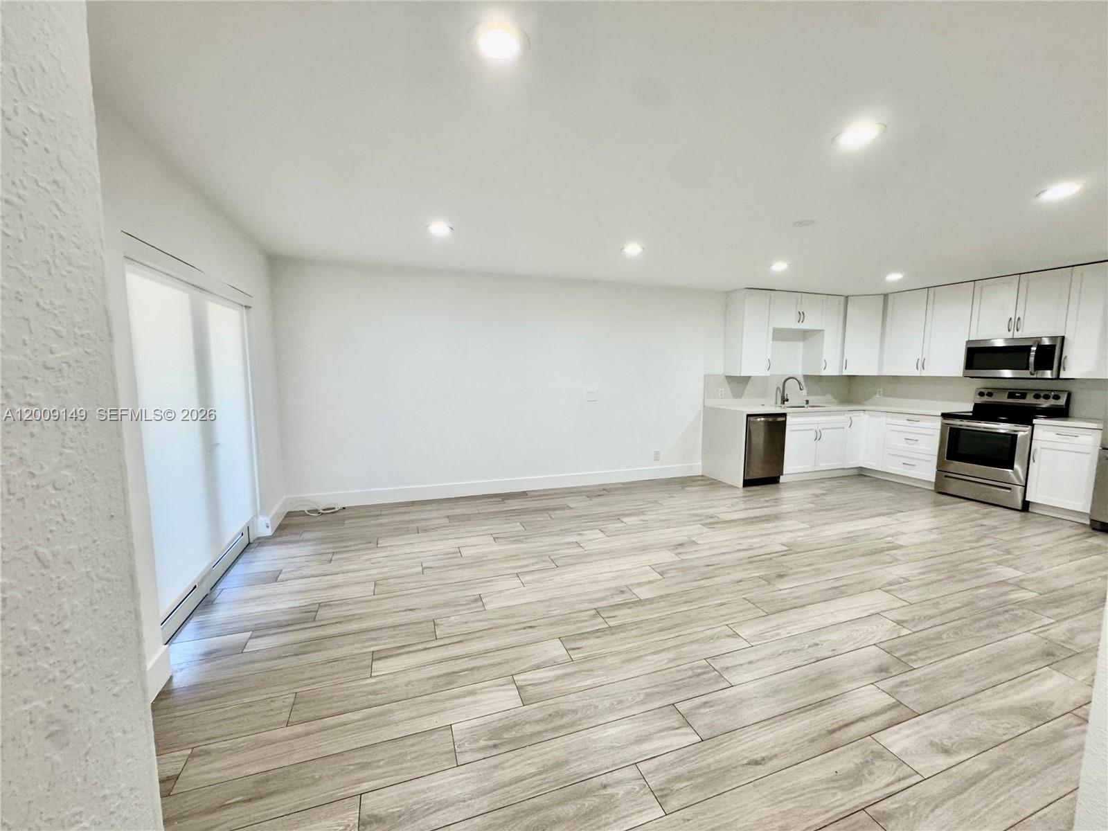 11770 Southwest 178th Terrace Miami, FL 33177 - Photo 5 of 13 a view of kitchen and wooden floor