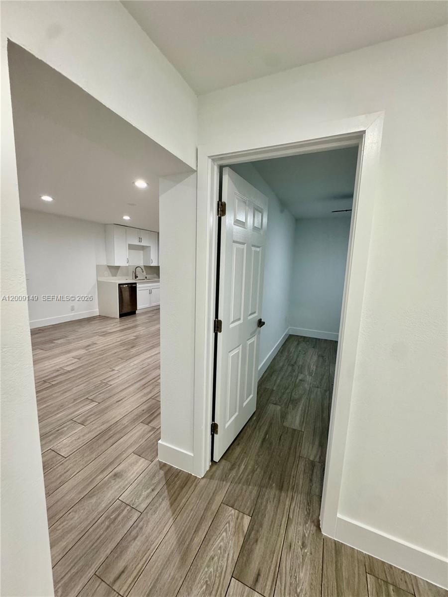 11770 Southwest 178th Terrace Miami, FL 33177 - Photo 6 of 13 a view of a hallway with wooden floor and staircase