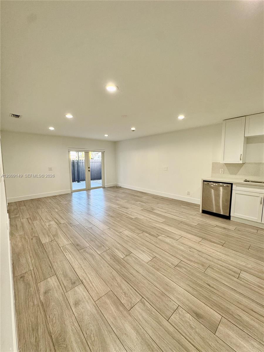 11770 Southwest 178th Terrace Miami, FL 33177 - Photo 7 of 13 a view of empty room with wooden floor