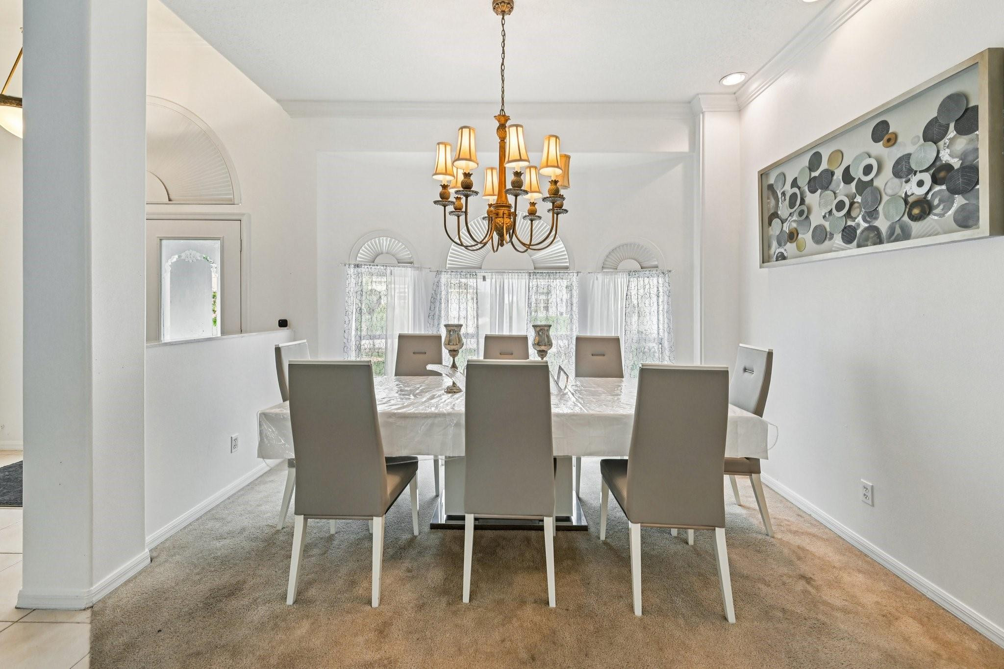 2041 Southwest Villanova Road Port St. Lucie, FL 34953 - Photo 12 of 45 a view of a dining room with furniture window and wooden floor