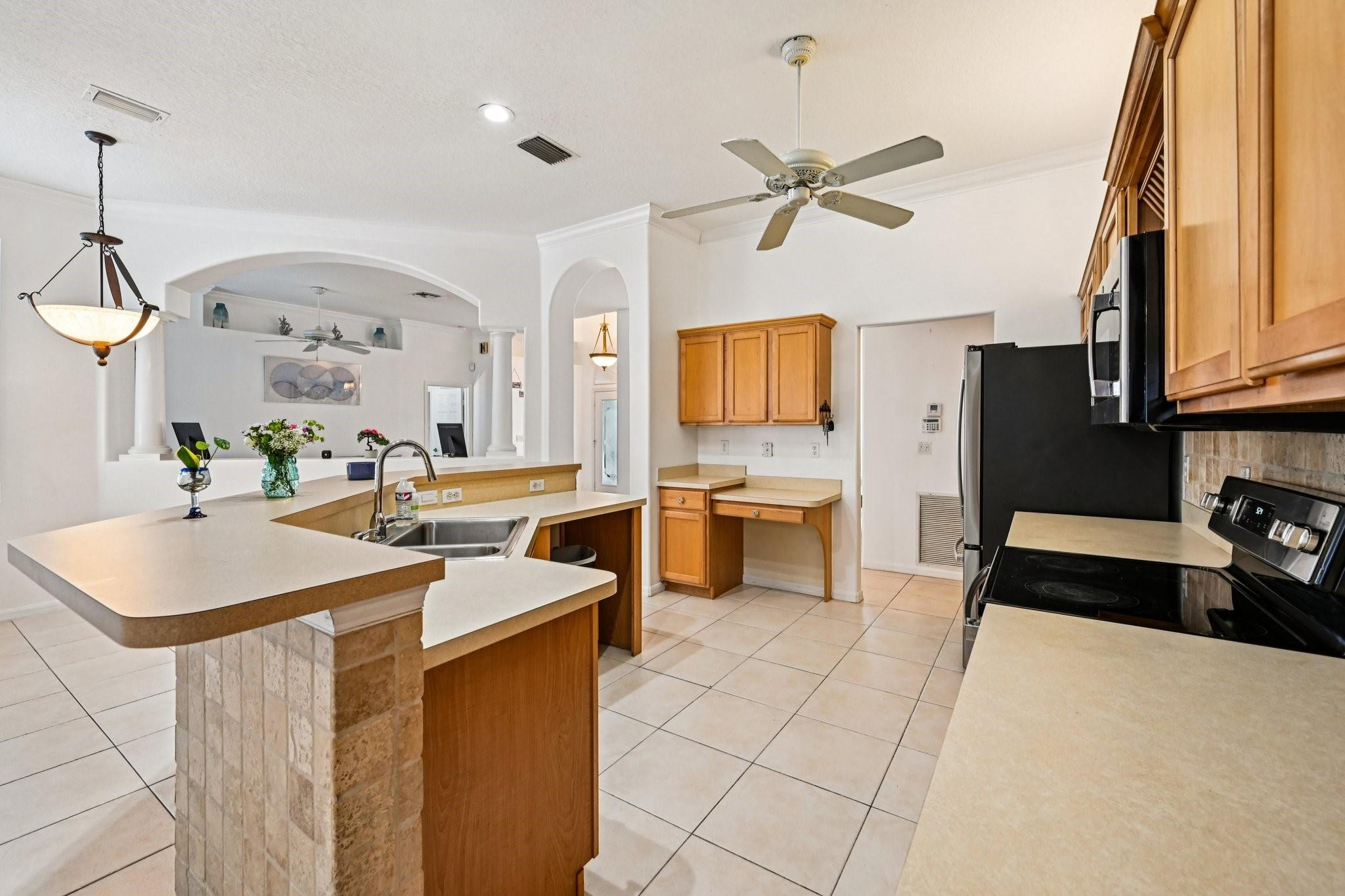 2041 Southwest Villanova Road Port St. Lucie, FL 34953 - Photo 16 of 45 a kitchen with a sink appliances and cabinets