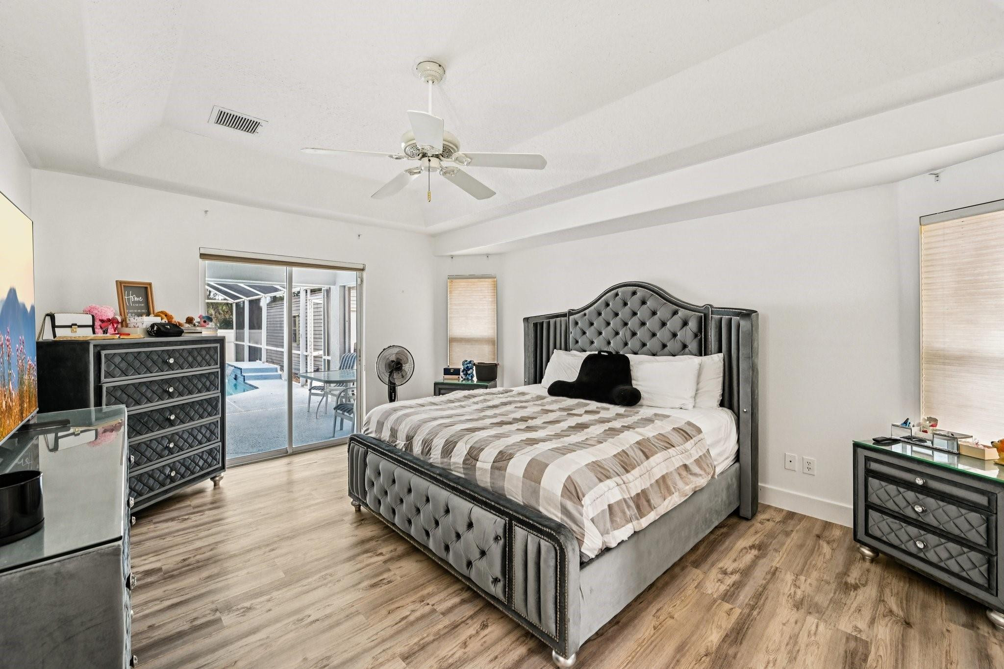 2041 Southwest Villanova Road Port St. Lucie, FL 34953 - Photo 17 of 45 a bedroom with a bed and a television