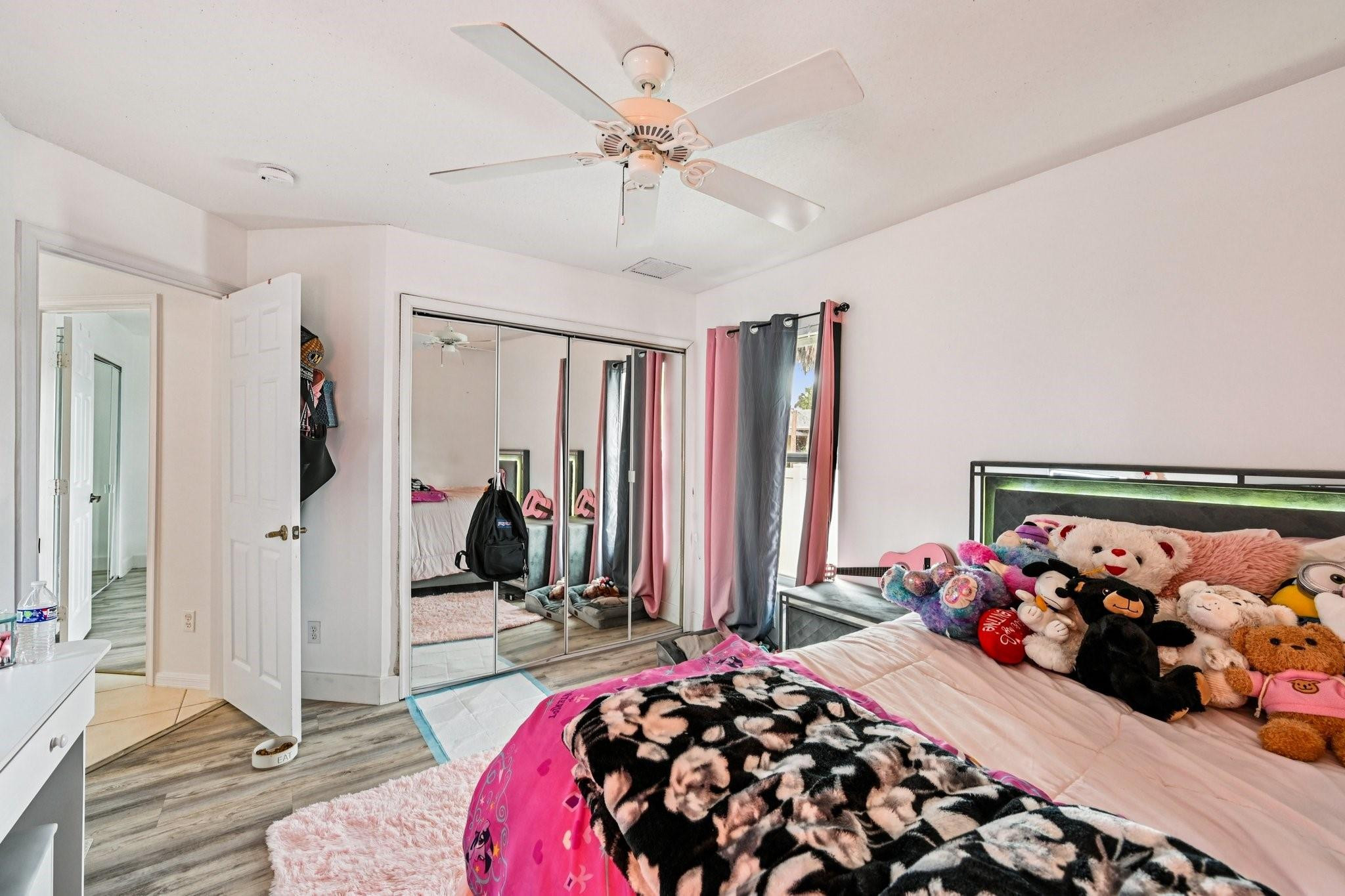 2041 Southwest Villanova Road Port St. Lucie, FL 34953 - Photo 29 of 45 a bedroom with bed and a window