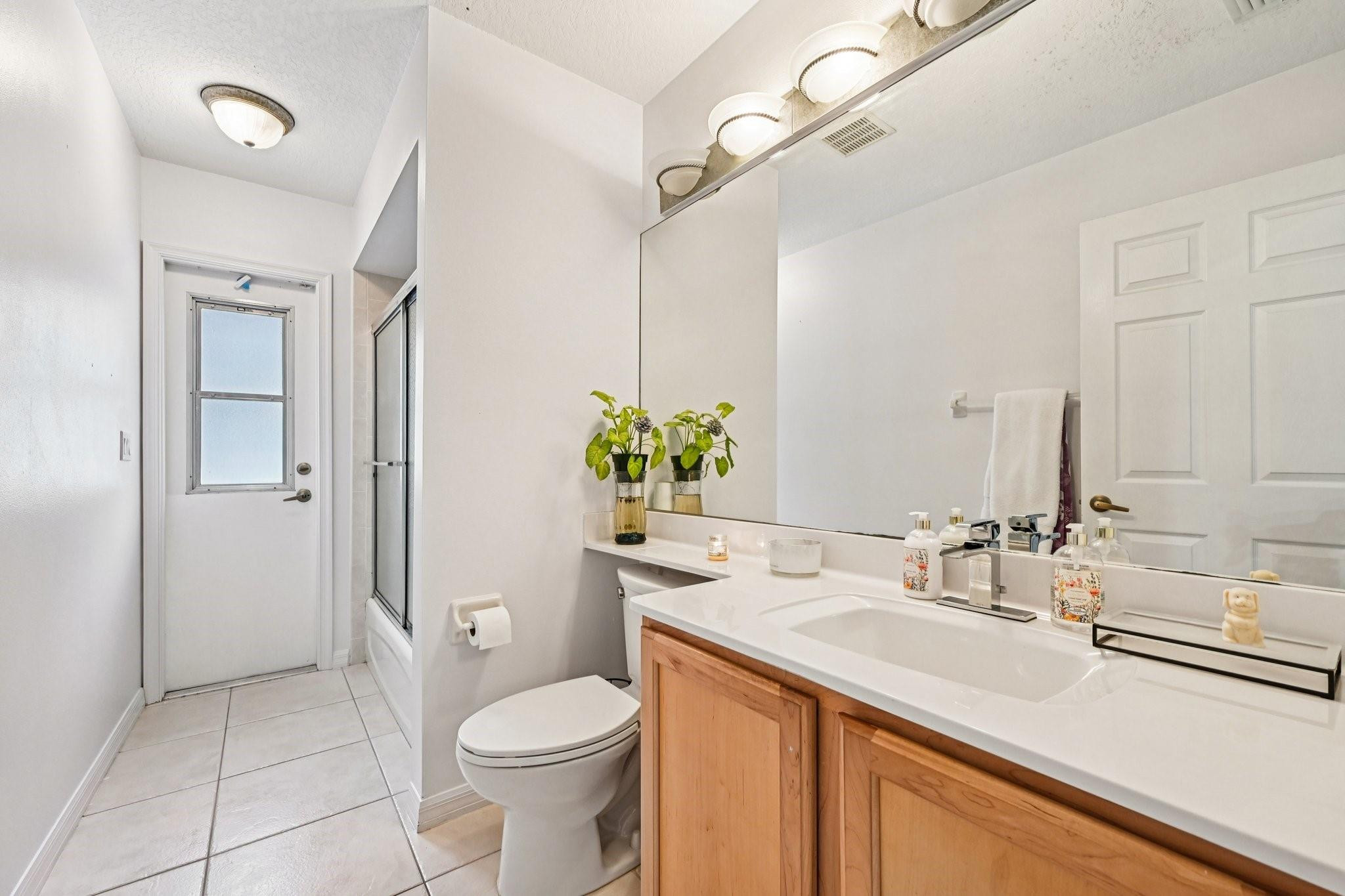 2041 Southwest Villanova Road Port St. Lucie, FL 34953 - Photo 30 of 45 a bathroom with a sink toilet and shower