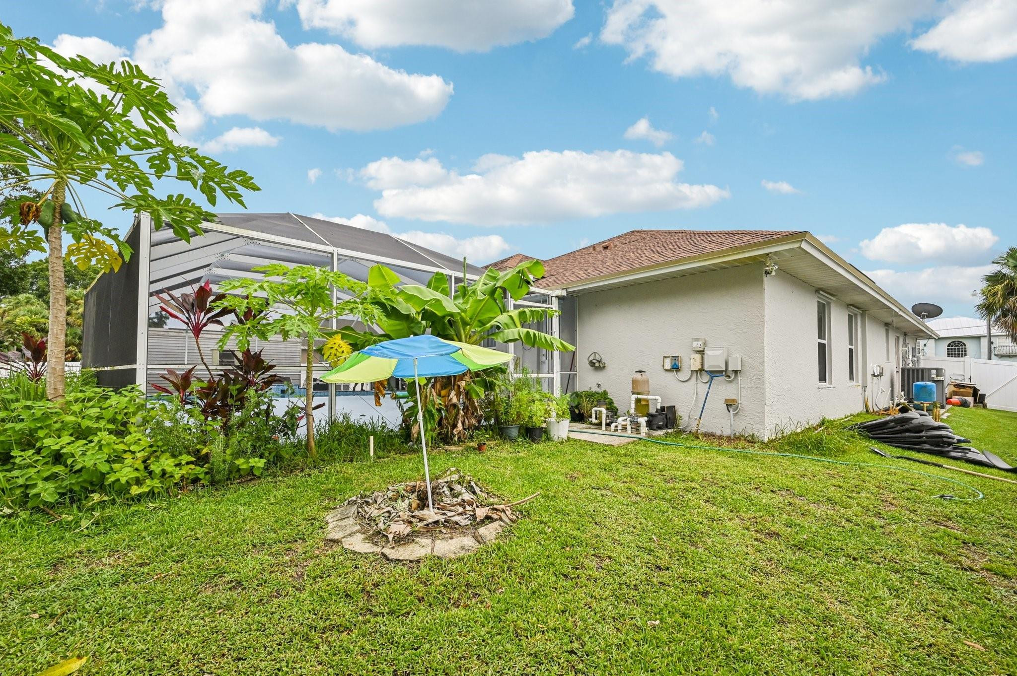 2041 Southwest Villanova Road Port St. Lucie, FL 34953 - Photo 35 of 45 a front view of a house with garden