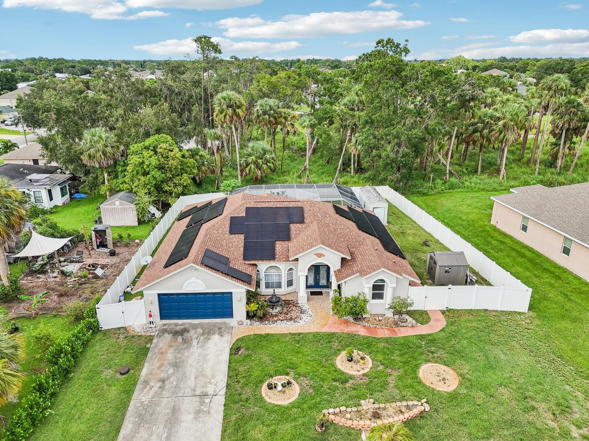 2041 Southwest Villanova Road Port St. Lucie, FL 34953 - Photo 37 of 45 an aerial view of house with garden space and trees