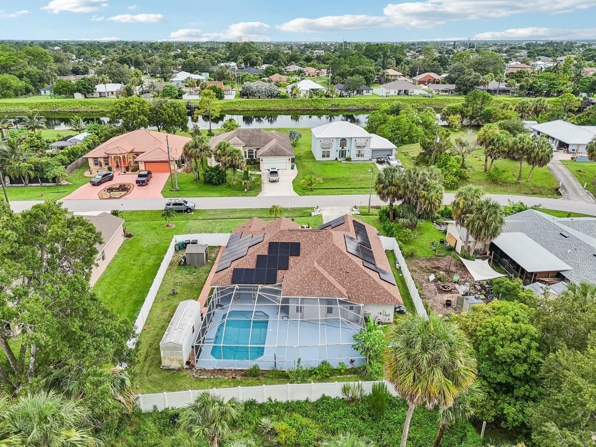 2041 Southwest Villanova Road Port St. Lucie, FL 34953 - Photo 40 of 45 an aerial view of a house with a garden
