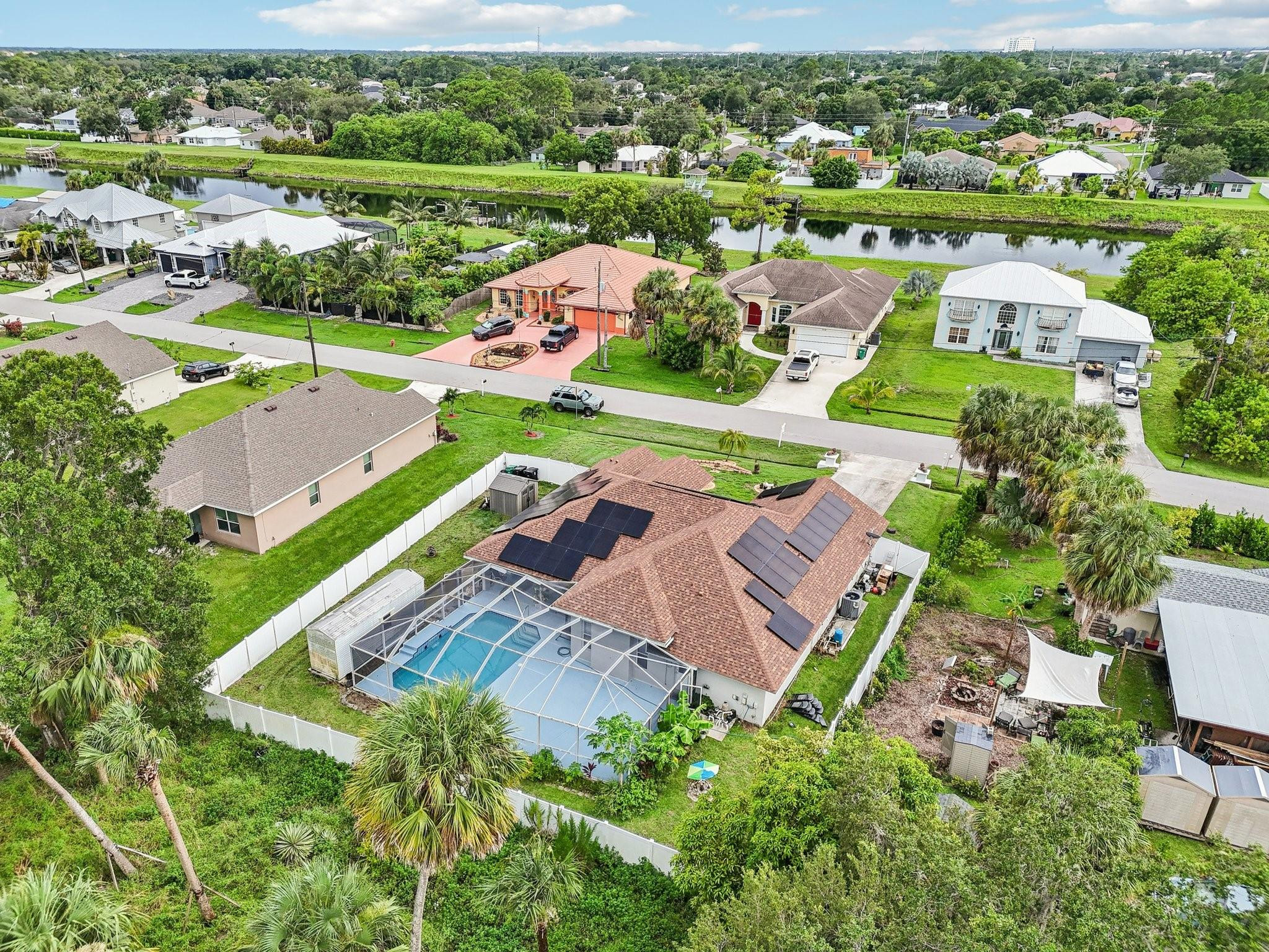 2041 Southwest Villanova Road Port St. Lucie, FL 34953 - Photo 41 of 45 an aerial view of a city with lots of residential buildings ocean and mountain view in back