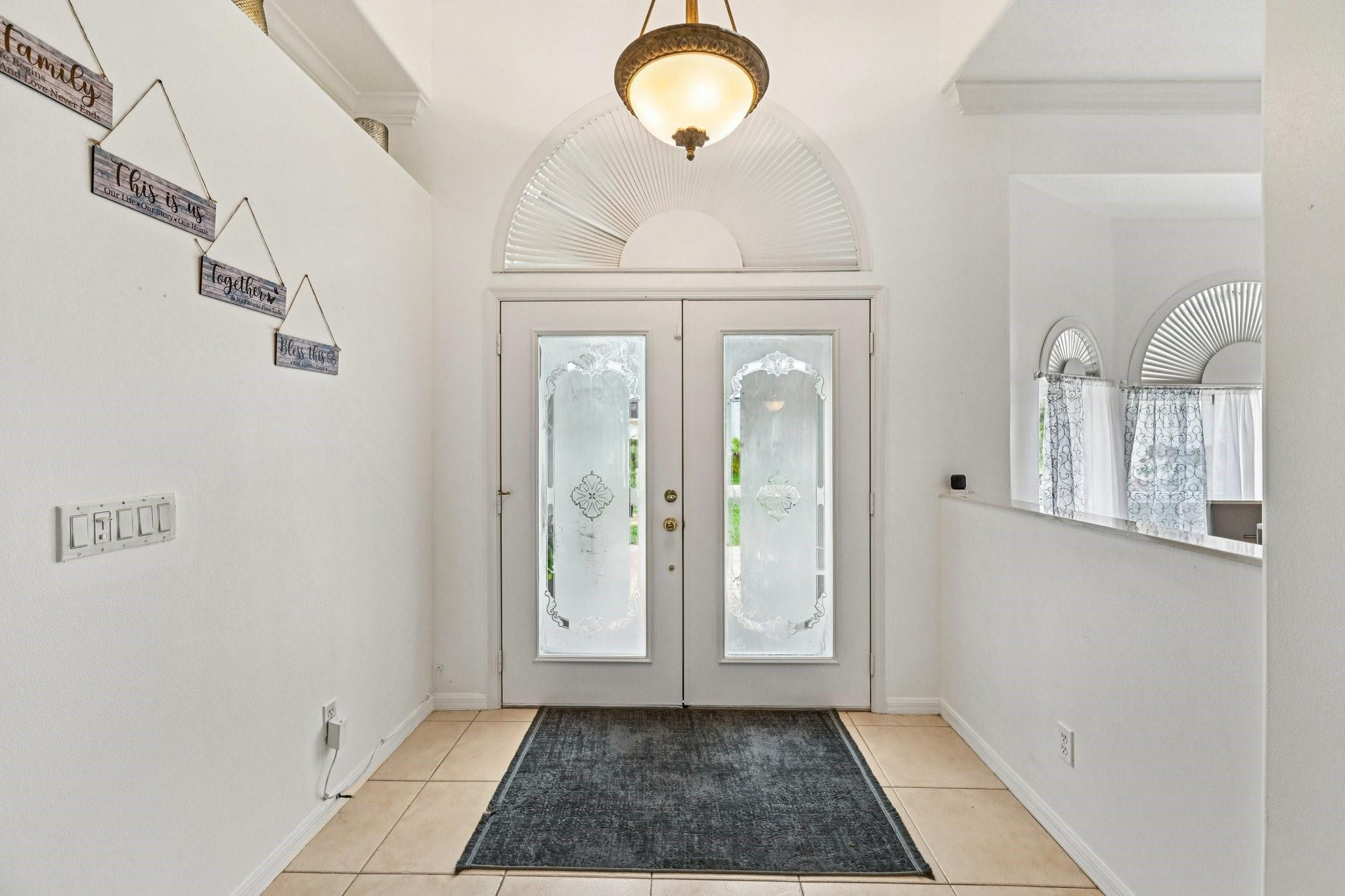 2041 Southwest Villanova Road Port St. Lucie, FL 34953 - Photo 6 of 45 a view of a room with wooden floor and cabinet