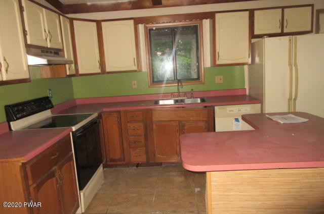 117 Kiel Road Milford, PA 18337 - Photo 20 of 25 a kitchen with a sink cabinets and a window