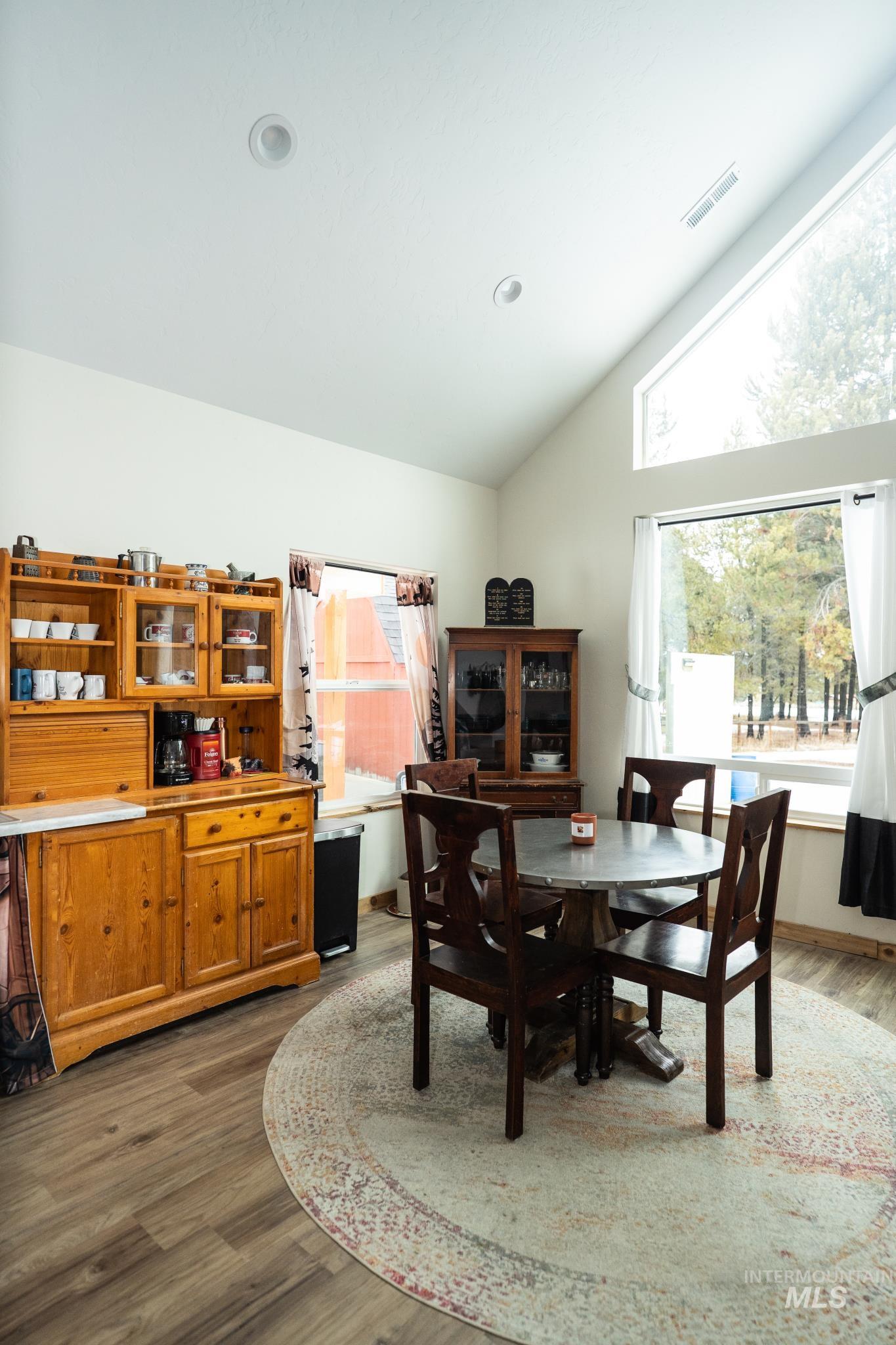 22 West Prospectors Drive Cascade, ID 83611 - Photo 8 of 29 Dining space featuring vaulted ceiling and light wood finished floors