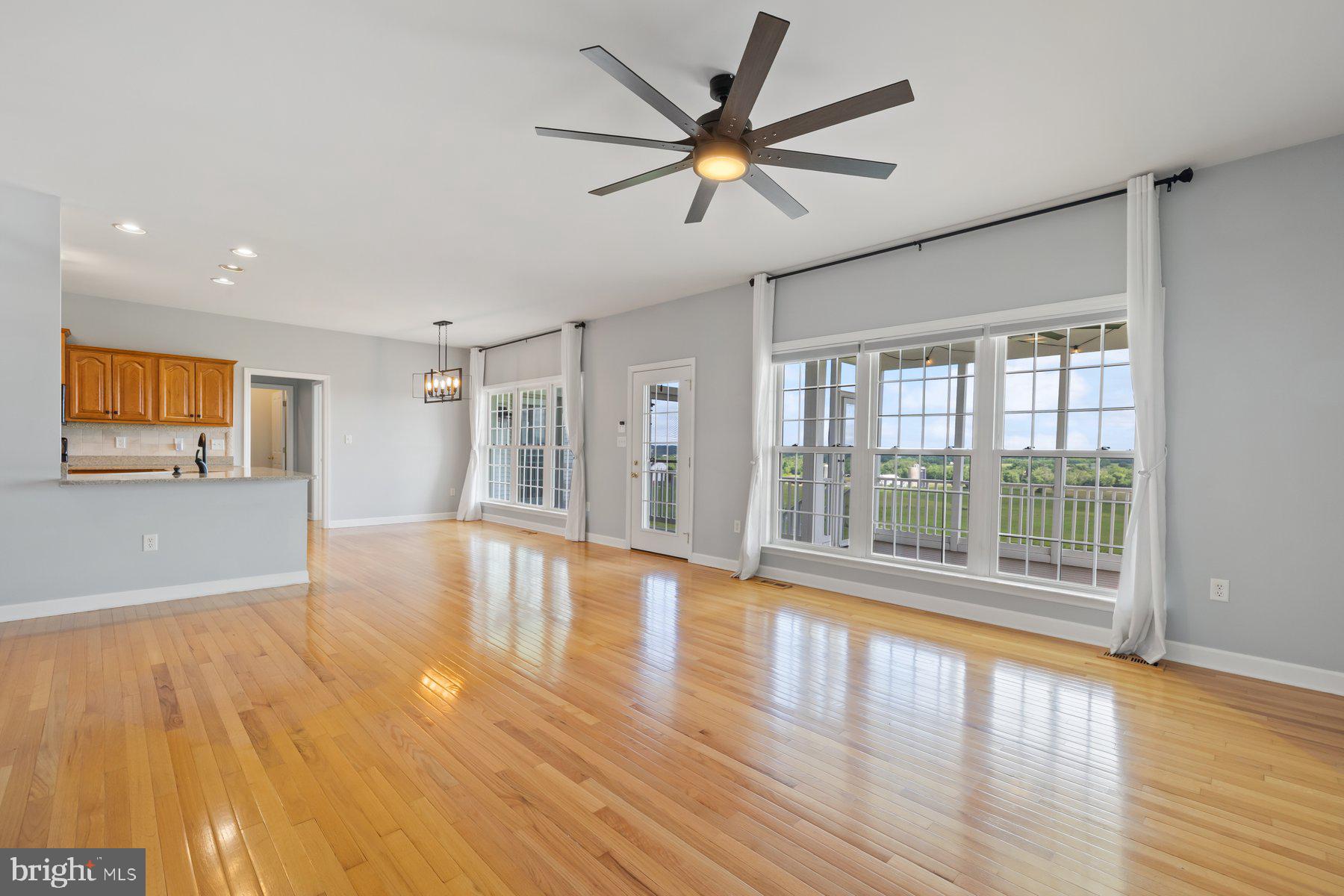 15920 Broadfording Road Hagerstown, MD 21740 - Photo 3 of 25 a view of an empty room with a window and wooden floor