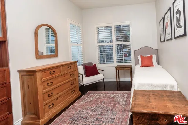 a bedroom with furniture and a window