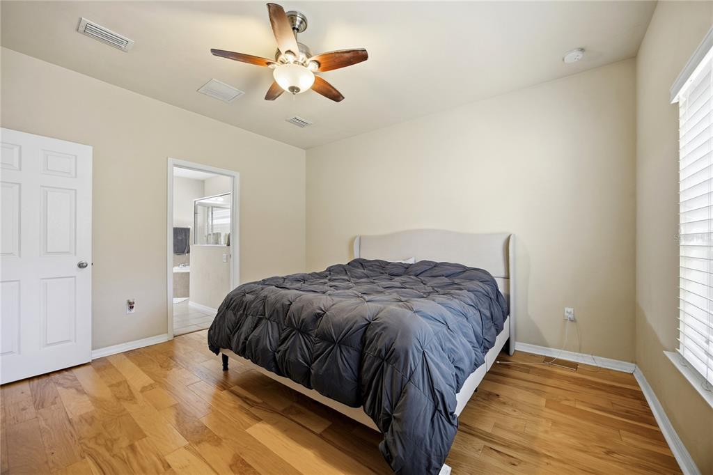 7550 Southwest 81st Way Gainesville, FL 32608 - Photo 17 of 31 a bedroom with a bed and window