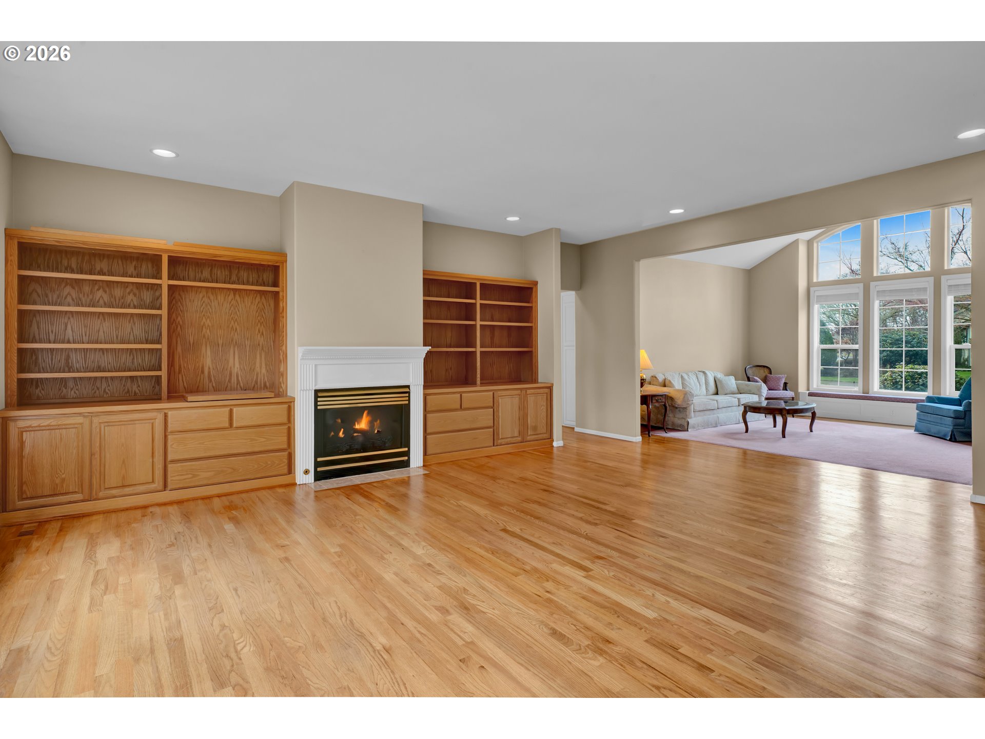 223 Beringer Court Eugene, OR 97404 - Photo 12 of 48 a view of empty room with wooden floor and fireplace