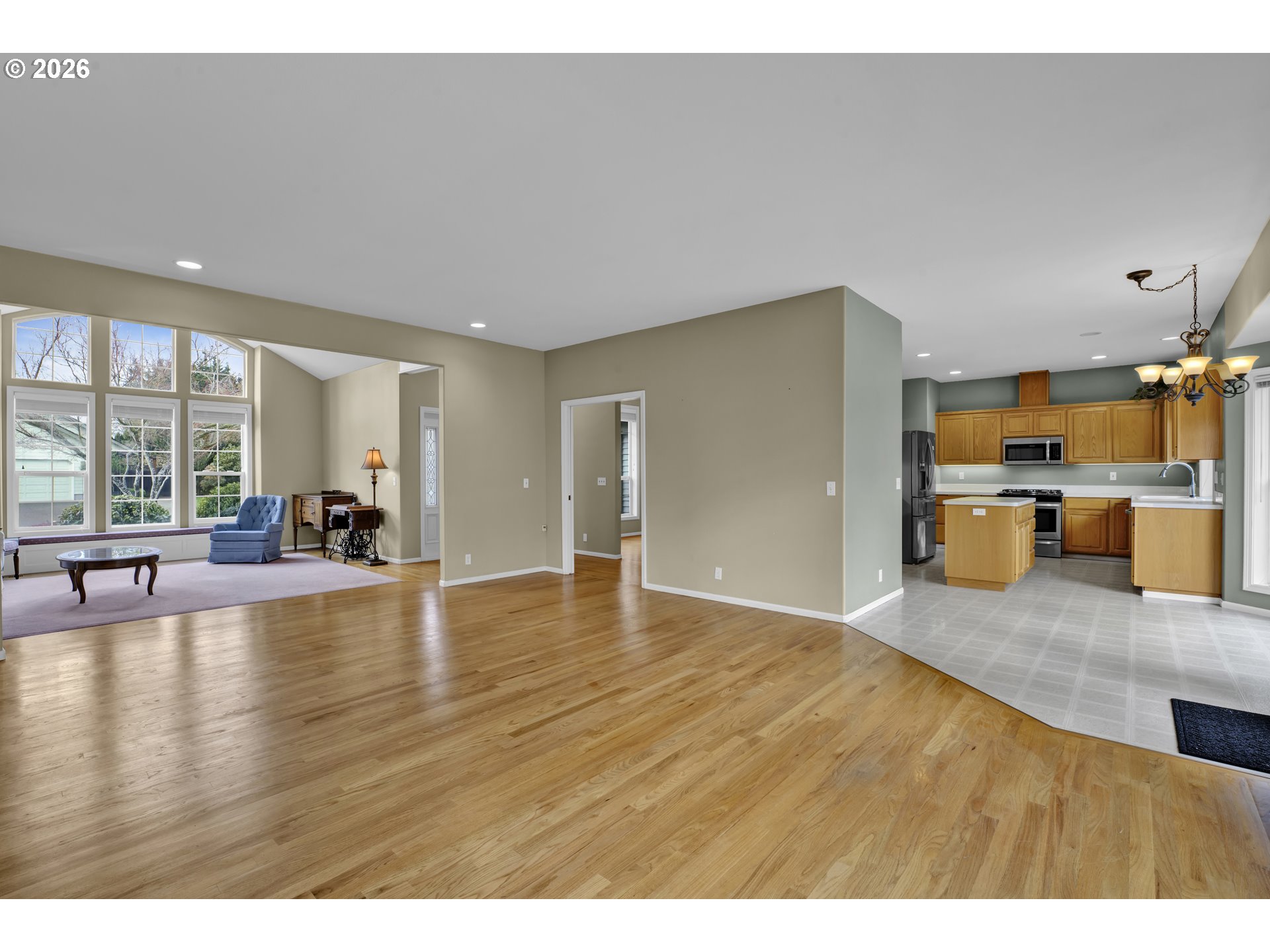223 Beringer Court Eugene, OR 97404 - Photo 13 of 48 a view of a kitchen with a sink hardwood floor and a kitchen counter top space