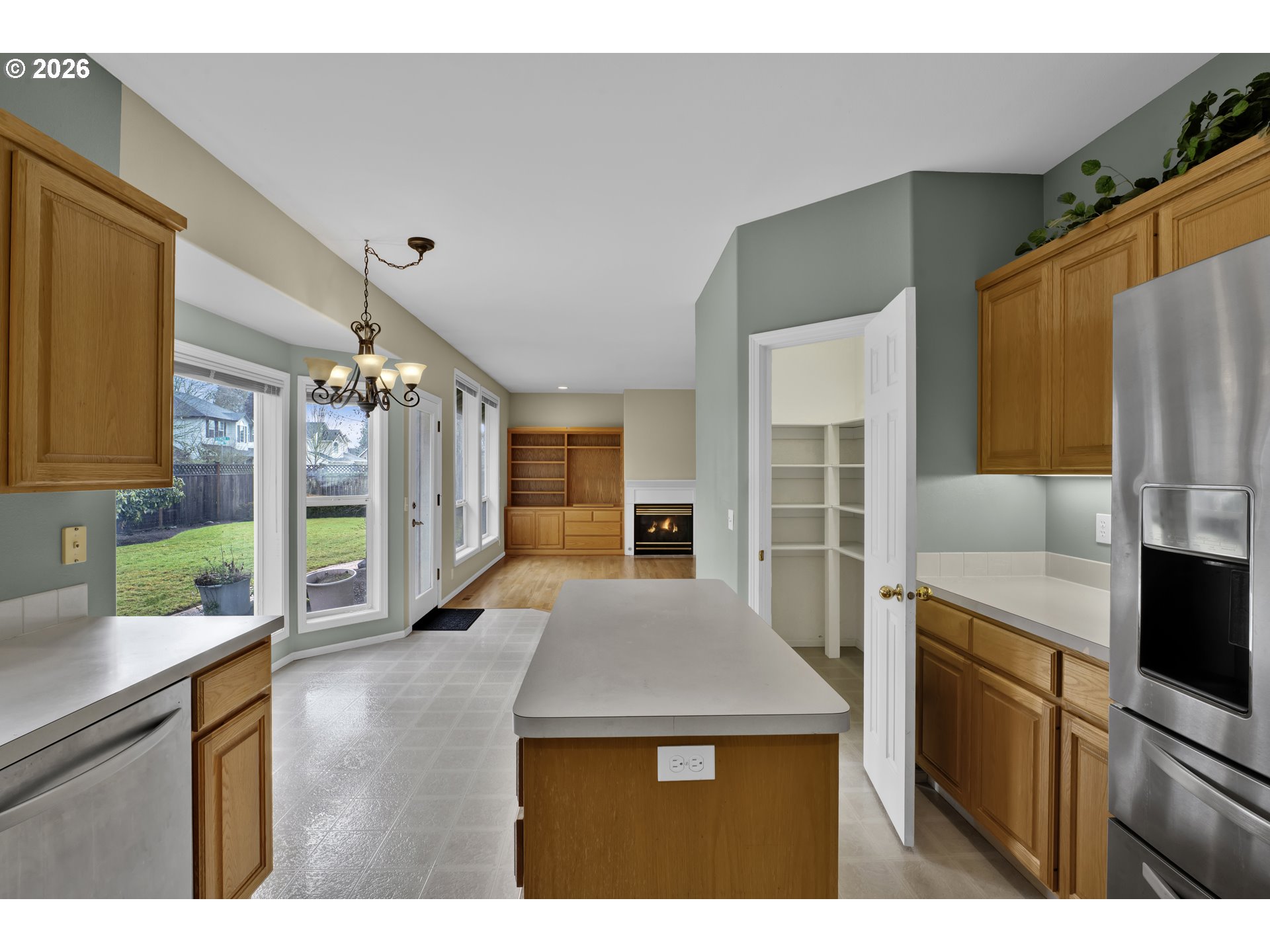 223 Beringer Court Eugene, OR 97404 - Photo 18 of 48 a kitchen with kitchen island a counter top space a sink appliances and cabinets