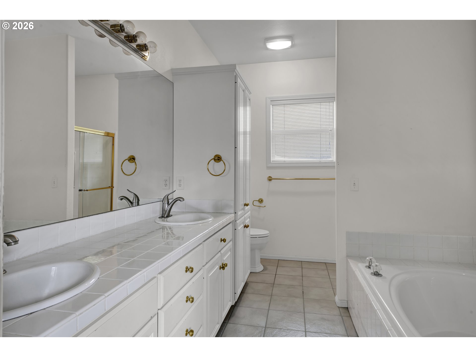 223 Beringer Court Eugene, OR 97404 - Photo 25 of 48 a bathroom with a granite countertop sink a mirror and a bathtub