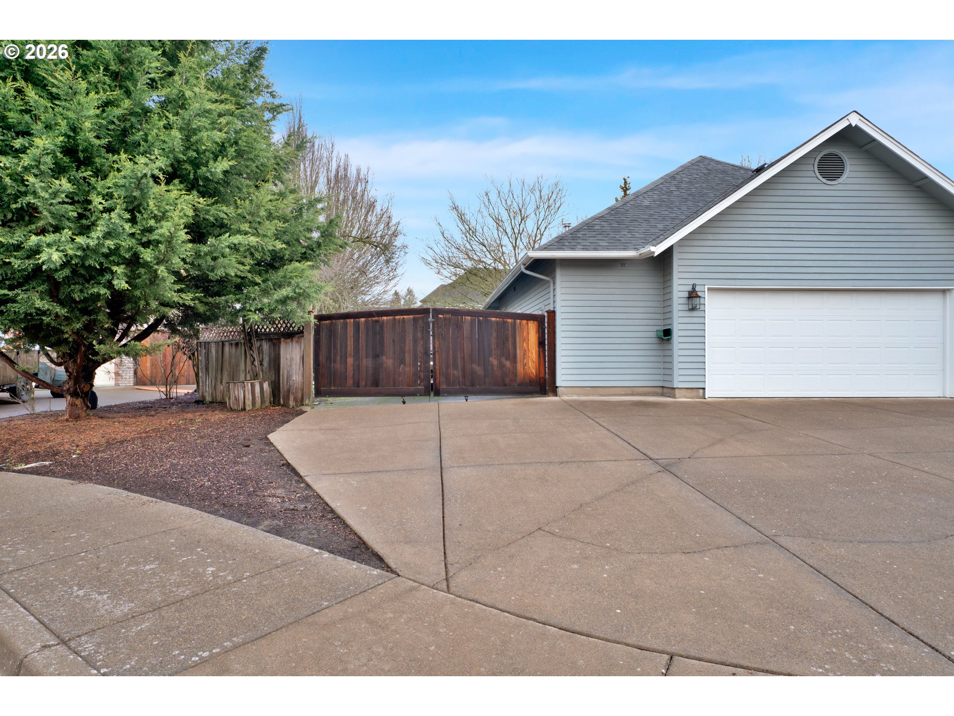 223 Beringer Court Eugene, OR 97404 - Photo 4 of 48 a front view of a house with a yard and garage