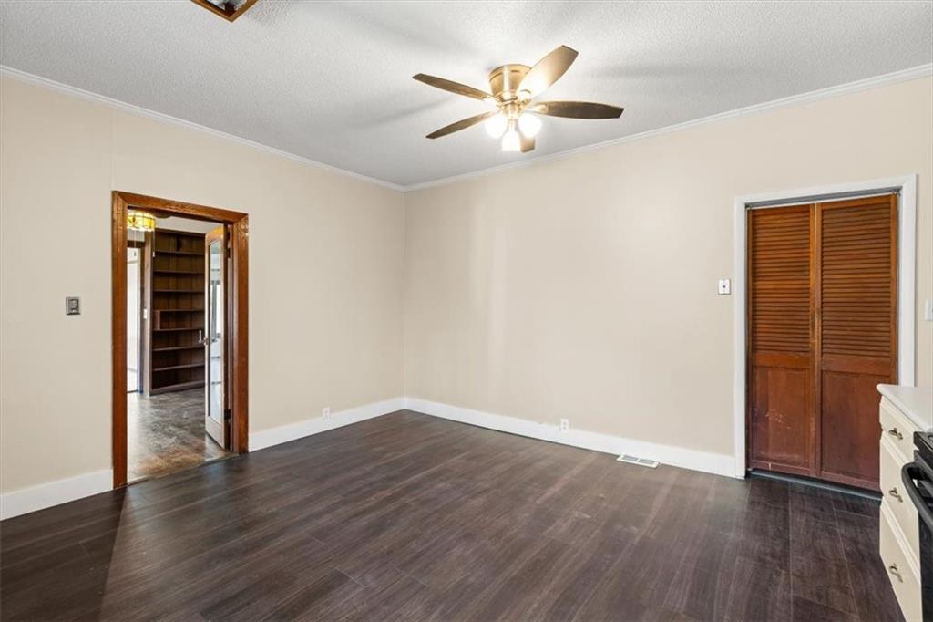 110 A Williams Road Southeast Silver Creek, GA 30173 - Photo 27 of 61 an empty room with wooden floor closet and windows