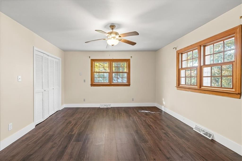 110 A Williams Road Southeast Silver Creek, GA 30173 - Photo 28 of 61 a view of empty room with wooden floor and fan