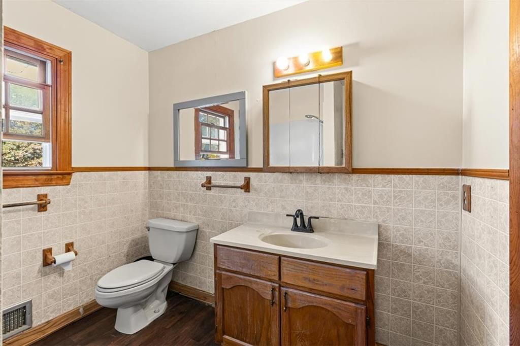 110 A Williams Road Southeast Silver Creek, GA 30173 - Photo 31 of 61 a bathroom with a toilet sink and mirror