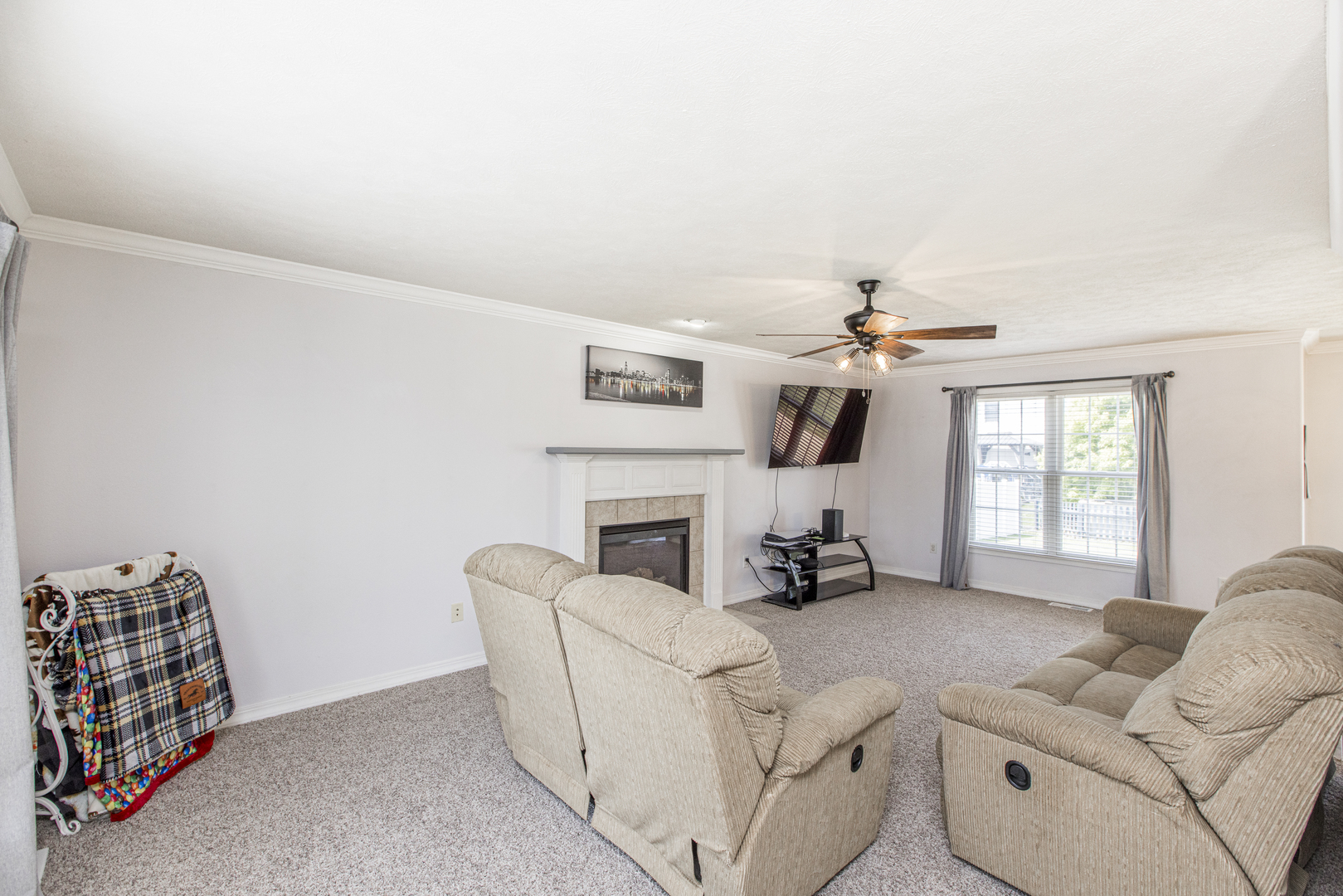 3230 Turquois Way Normal, IL 61761 - Photo 7 of 28 a living room with furniture a fireplace and a flat screen tv