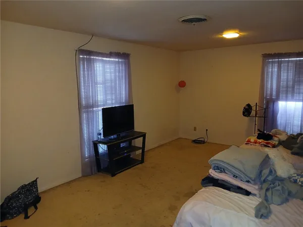 a bedroom with a bed and furniture