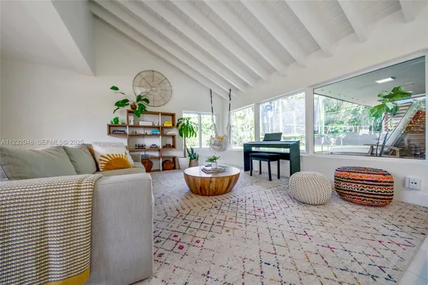 a bedroom with a bed and a potted plant