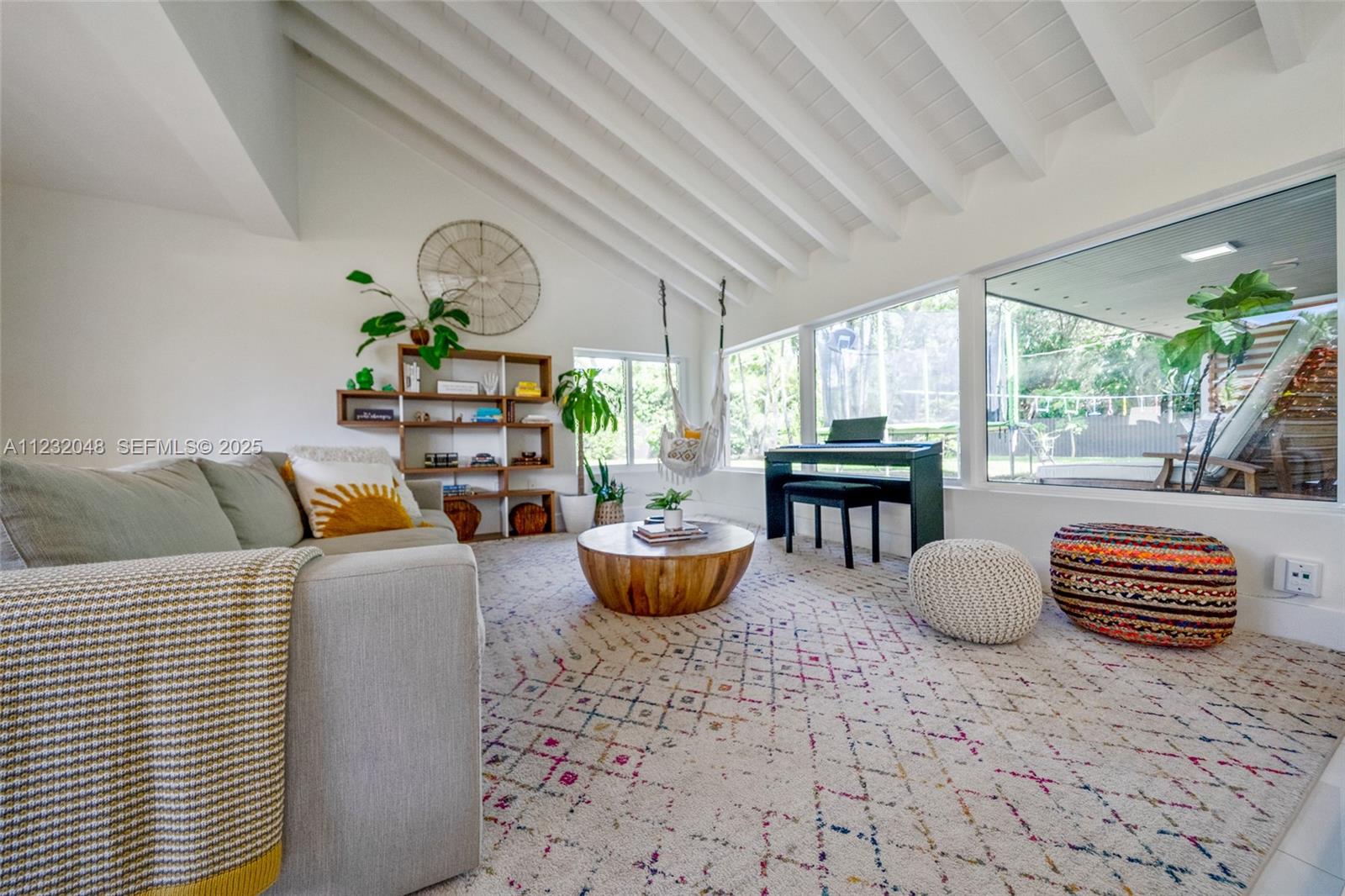 7544 Southwest 78th Terrace Miami, FL 33143 - Photo 19 of 60 a living room with furniture and a window