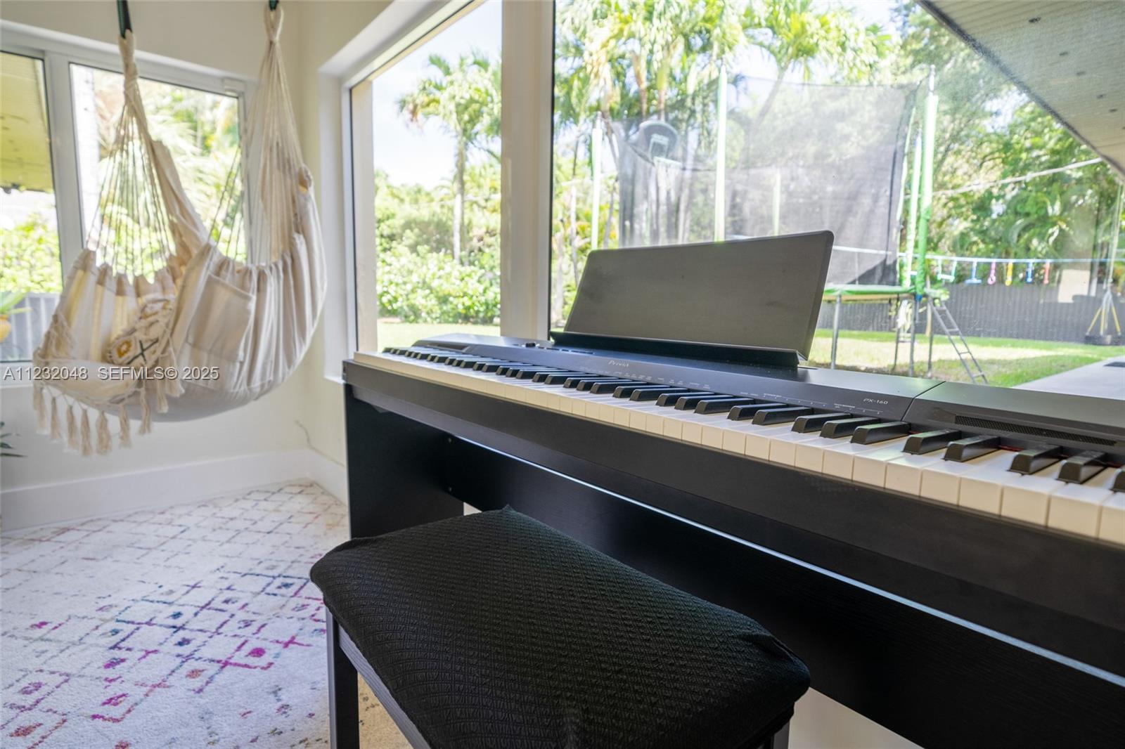 7544 Southwest 78th Terrace Miami, FL 33143 - Photo 20 of 60 a view of workspace with wooden floor space and balcony