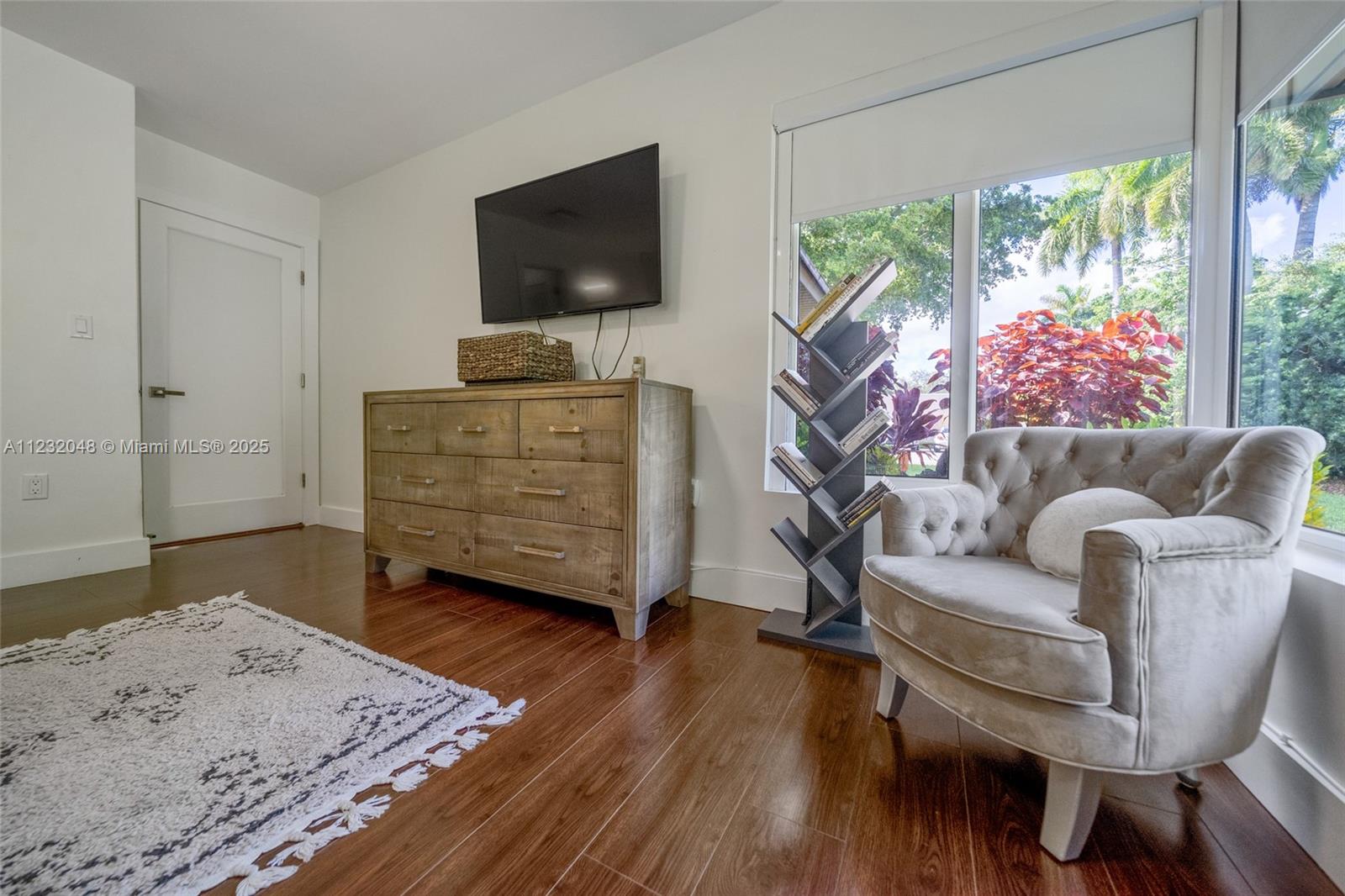 7544 Southwest 78th Terrace Miami, FL 33143 - Photo 29 of 60 a living room with furniture and a flat screen tv