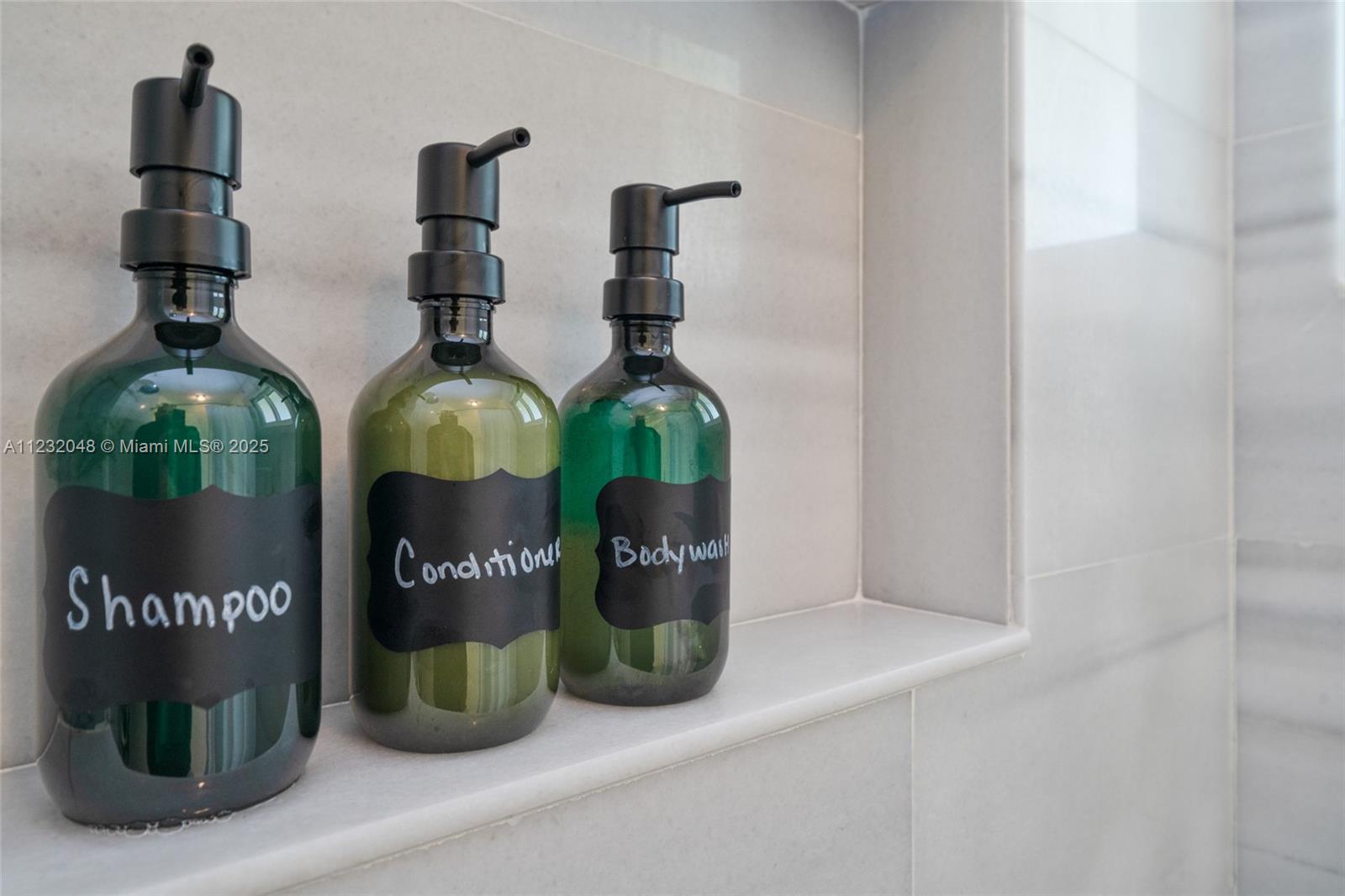 7544 Southwest 78th Terrace Miami, FL 33143 - Photo 33 of 60 a table with wine bottles and glasses on it