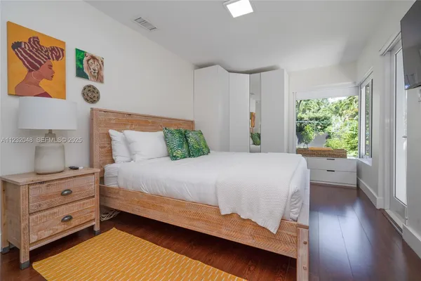 a bedroom with a bed and window