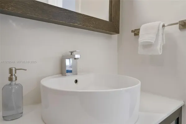 a bathroom with a sink toilet and vanity