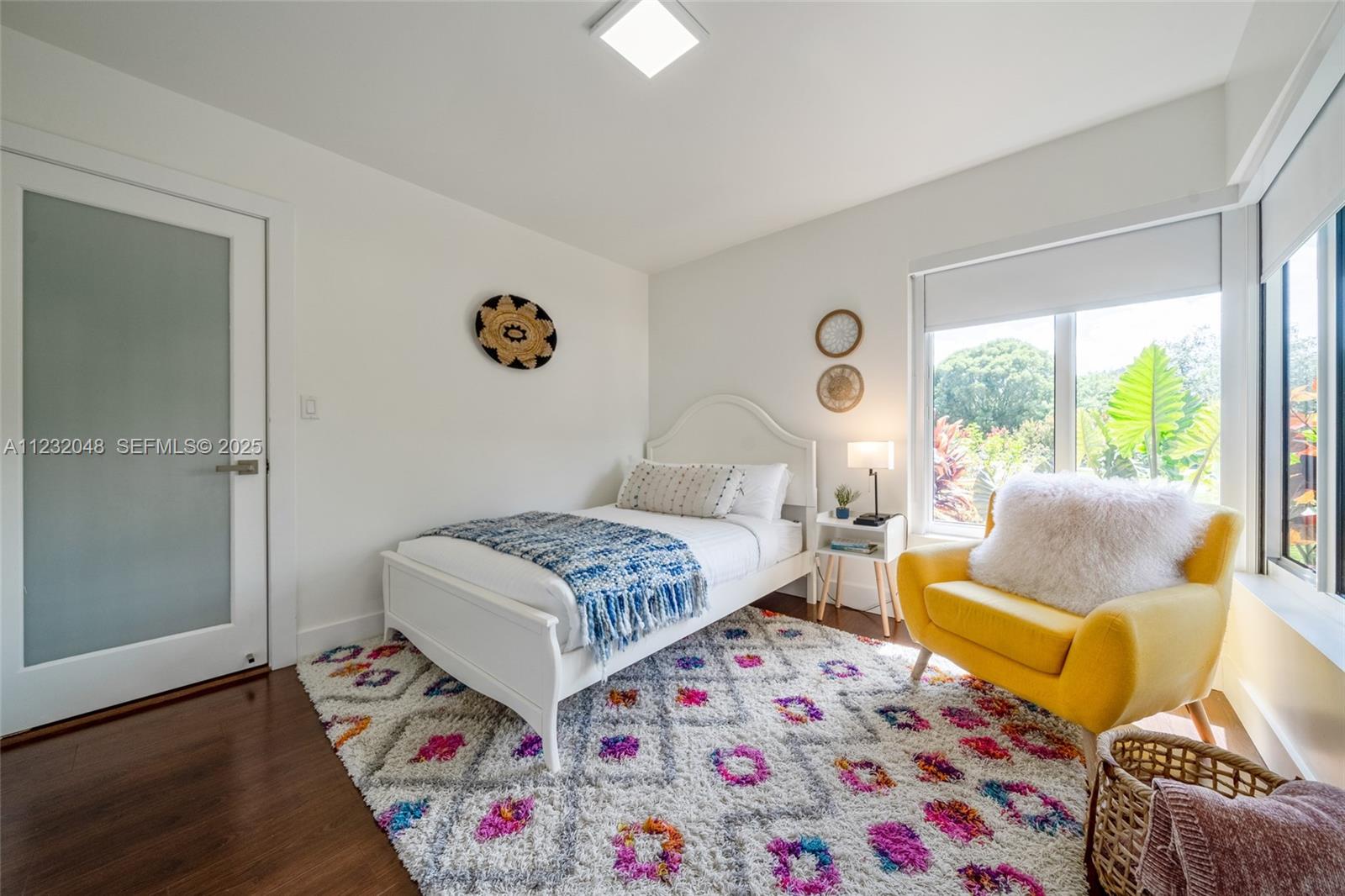 7544 Southwest 78th Terrace Miami, FL 33143 - Photo 41 of 60 a bedroom with a bed and wooden floor