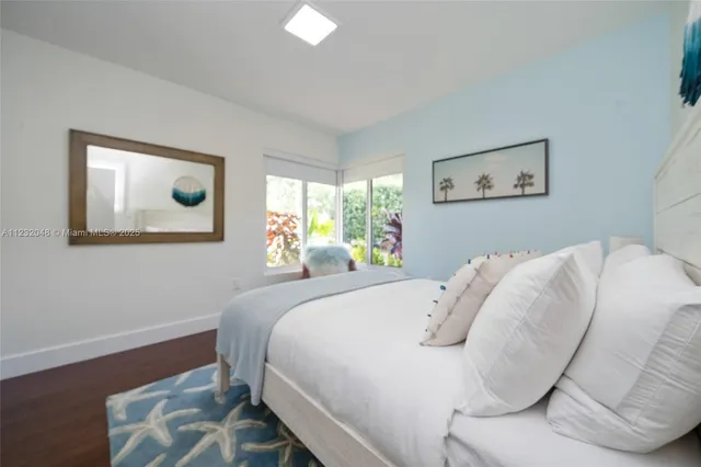 a view of a chair and table in the garden