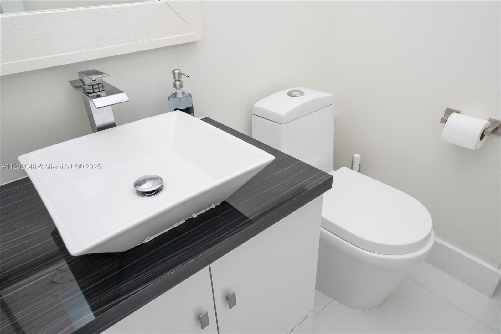 7544 Southwest 78th Terrace Miami, FL 33143 - Photo 47 of 60 a bathroom with a sink and a toilet