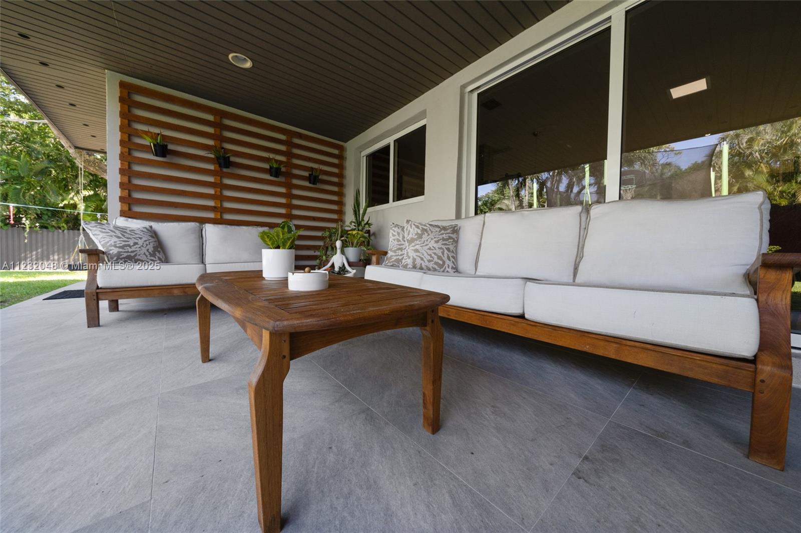 7544 Southwest 78th Terrace Miami, FL 33143 - Photo 50 of 60 a living room with furniture and a potted plant