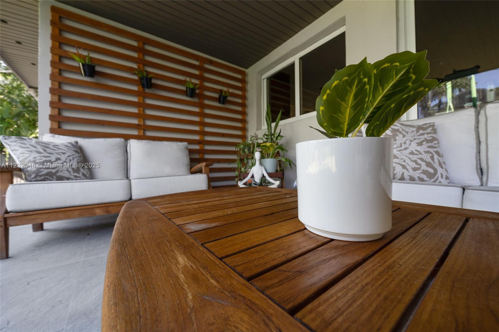 7544 Southwest 78th Terrace Miami, FL 33143 - Photo 51 of 60 a view of a dining room with furniture and a potted plant