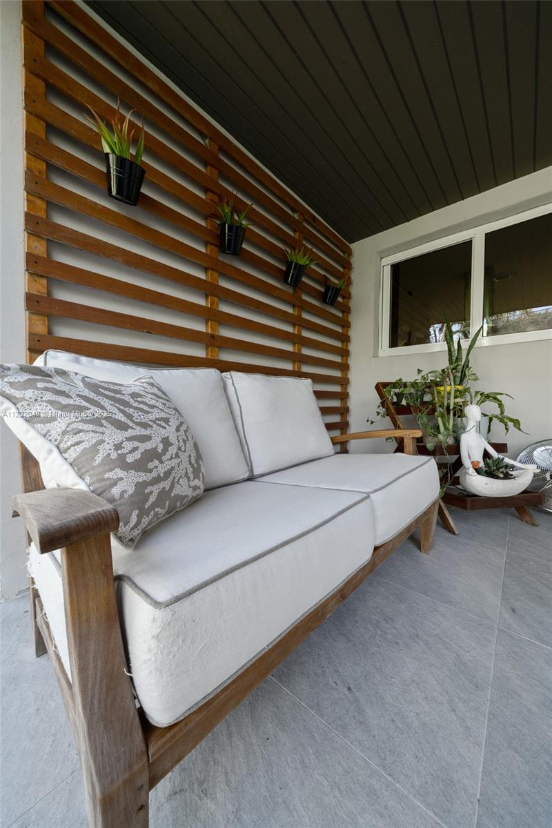 7544 Southwest 78th Terrace Miami, FL 33143 - Photo 53 of 60 a bedroom with furniture and a flat screen tv