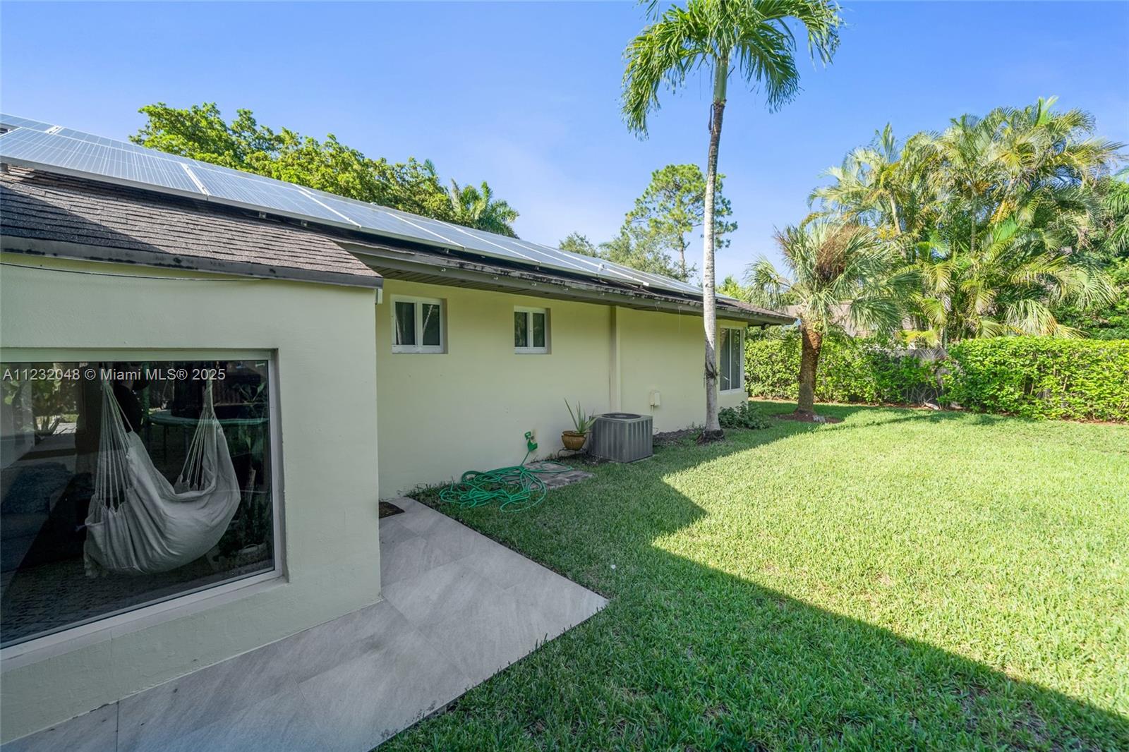 7544 Southwest 78th Terrace Miami, FL 33143 - Photo 57 of 60 a house with garden in front of it