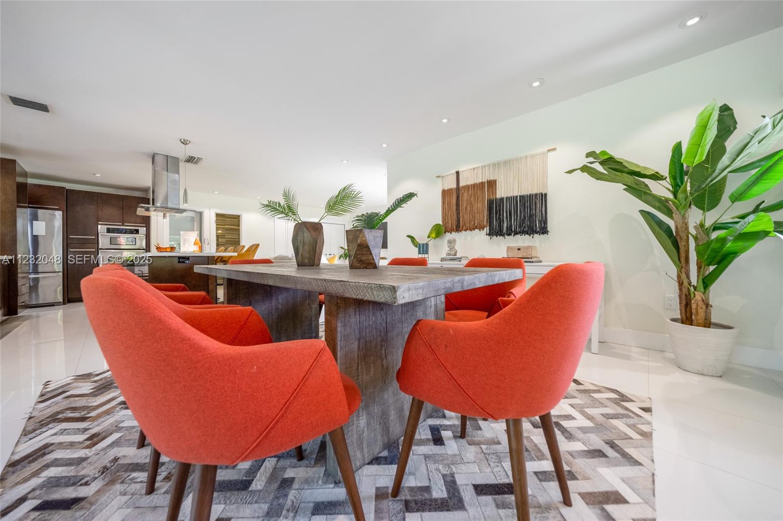 7544 Southwest 78th Terrace Miami, FL 33143 - Photo 6 of 60 a dining room filled with furniture and a potted plant
