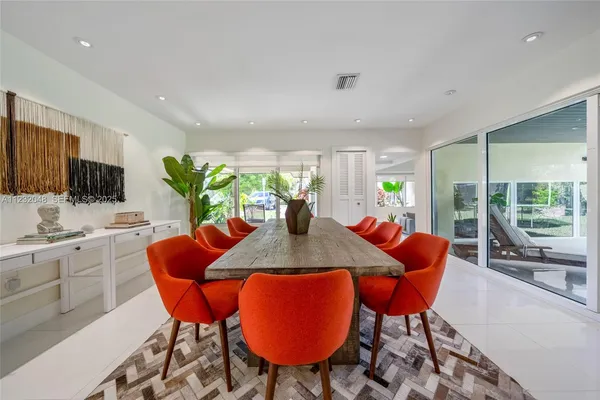 a kitchen with stainless steel appliances a sink dishwasher stove refrigerator and cabinets